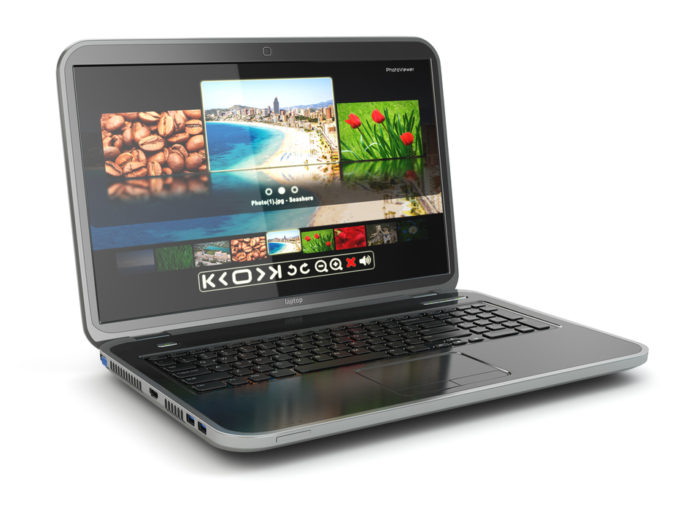 Laptop with photoviewer on screen. 3d
