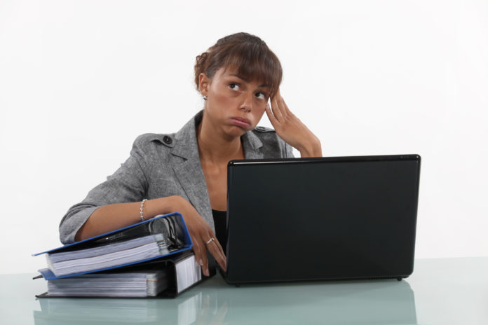 Woman overwhelmed at work