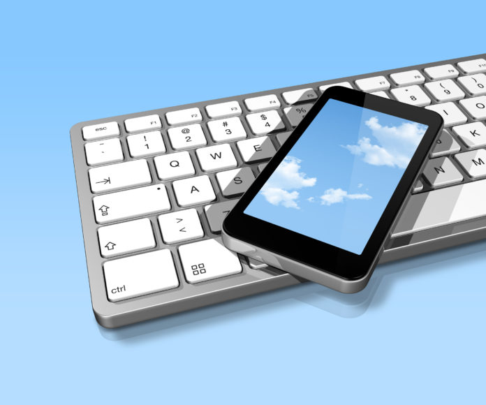 mobile phone on a computer keyboard