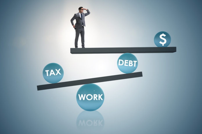 Businessman in debt and tax business concept